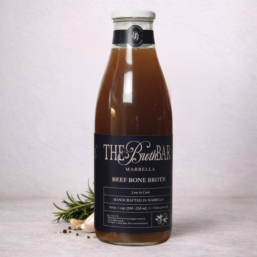 Bottle of The Broth Bar beef bone broth on a light background