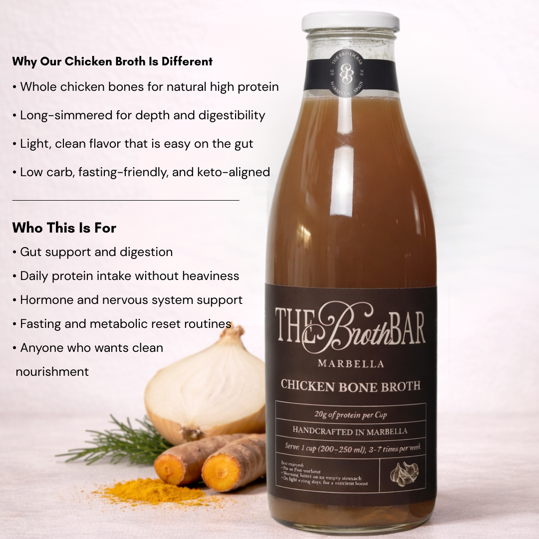 Bottle of The Broth Bar chicken bone broth with ingredients and product details on a white background
