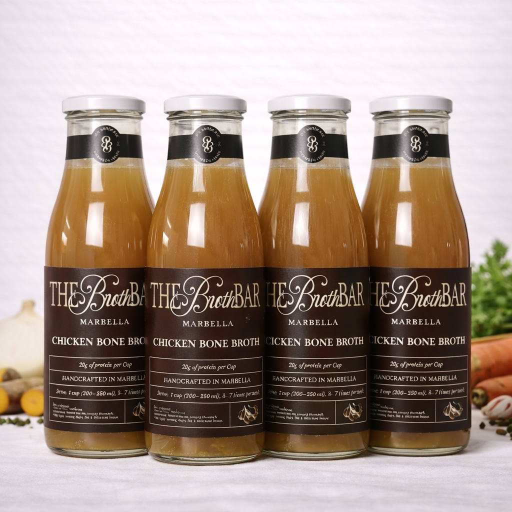 Four bottles of The Broth Bar chicken bone broth on a white background